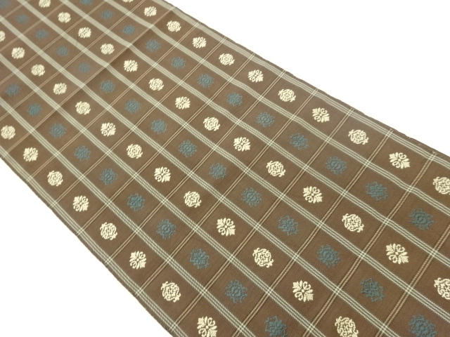 Nagoya obi woven with an abstract pattern on a lattice